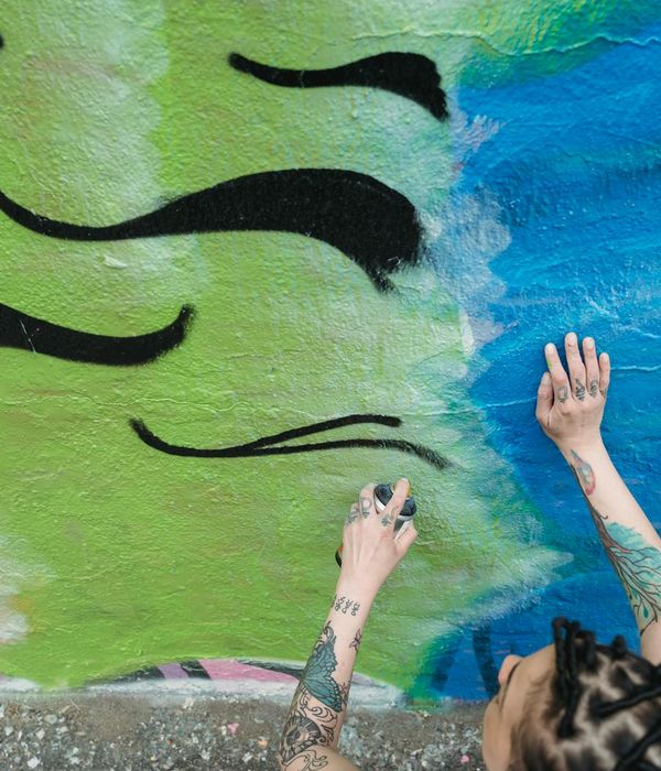 Graffiti wall with neon spray art depicting Kazakhstan steppe and urban texture